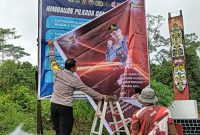 Melali Spanduk, Polsek Muara Jawa Himbau Warga Pasca Pilkada