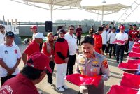 Kapolres Kutai Kartanegara Hadiri dan Kawal Langsung Gerakan Pembagian 10 Juta Bendera Sambut HUT RI ke-80