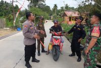 Sinergitas Tiga Pilar Hadir di Tengah Warga, Bhabinkamtibmas Polsek Muara Kaman Aktif Patroli Jaga Keamanan Desa